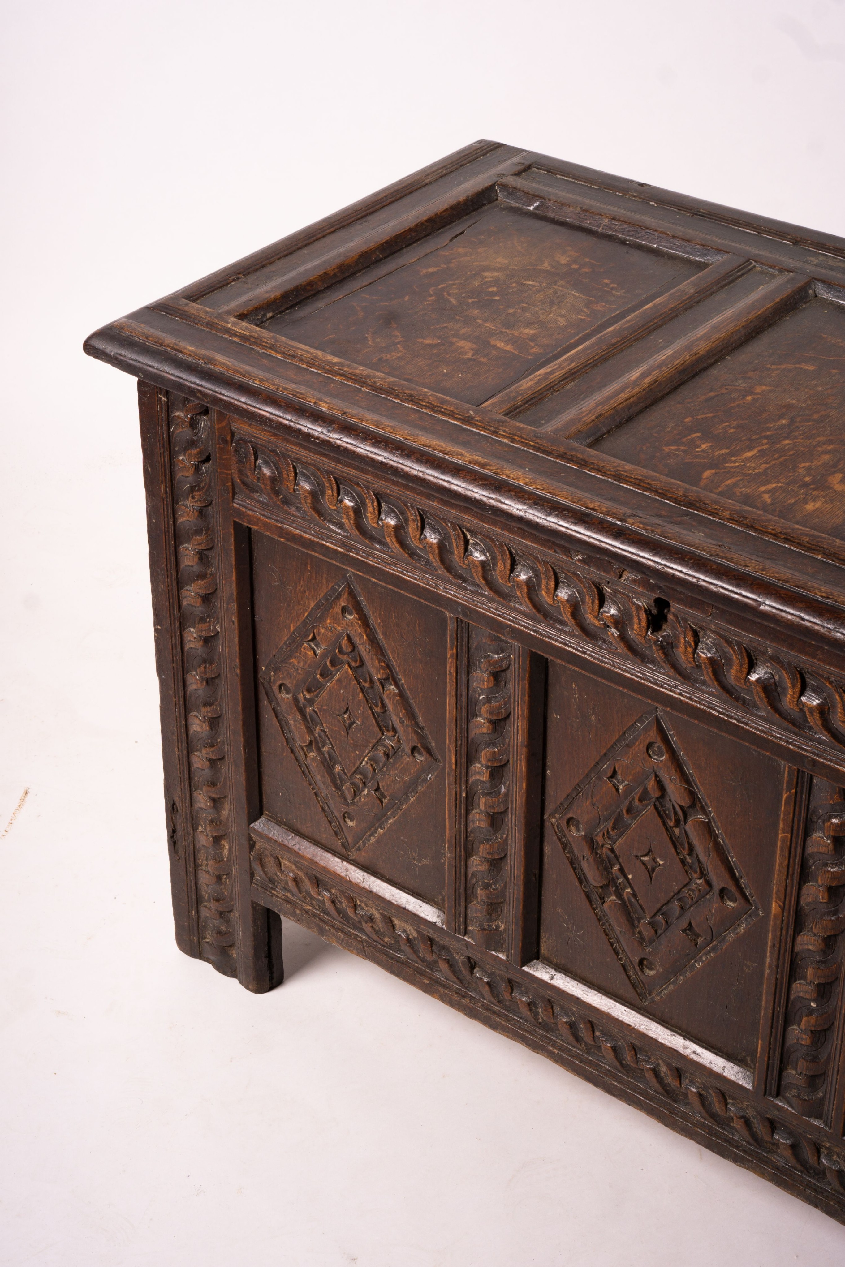 A 17th century carved panelled oak coffer, length 115cm, depth 56cm, height 67cm